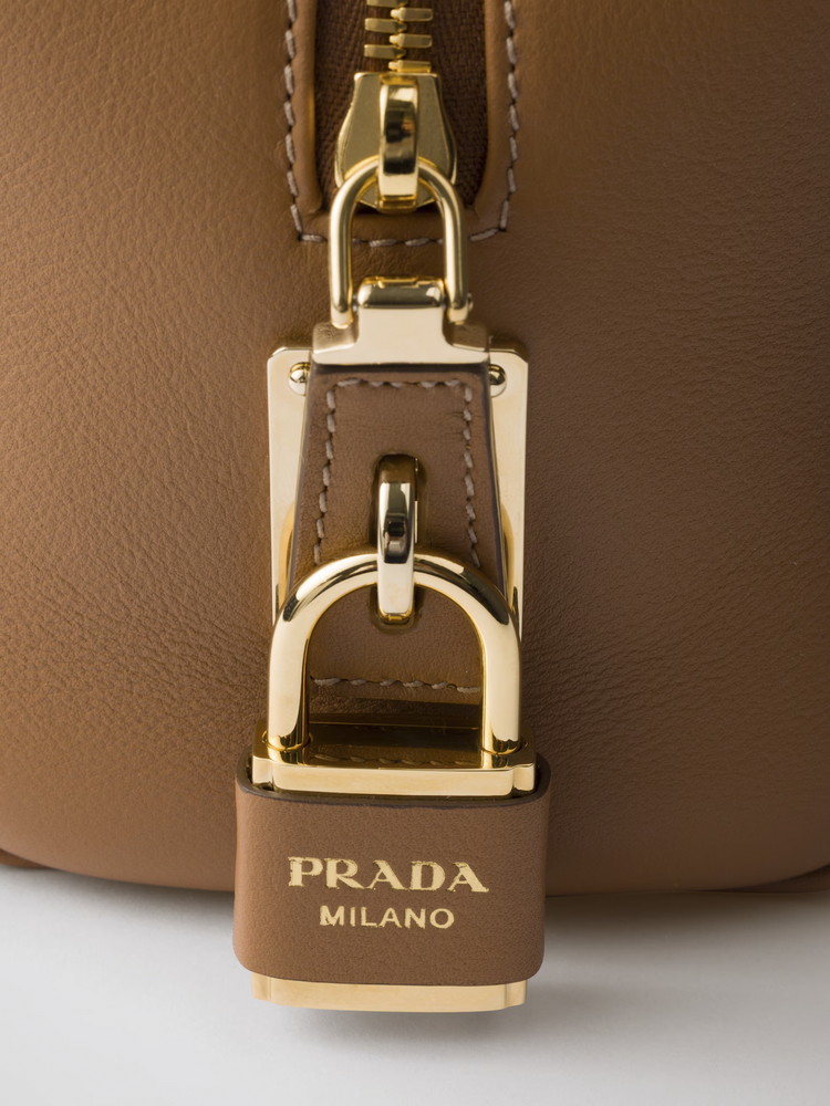 Re-Nylon and leather medium top-handle bag with padlock