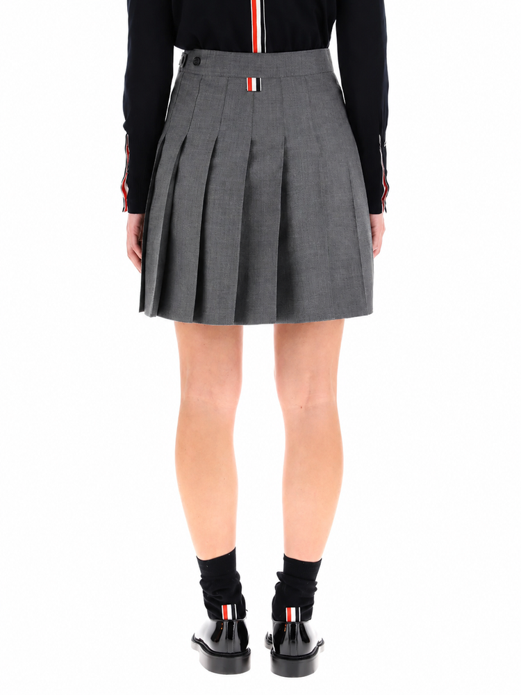 THIGH LENGTH DROPPED BACK PLEATED SKIRT IN SUPER 120’S TWILL