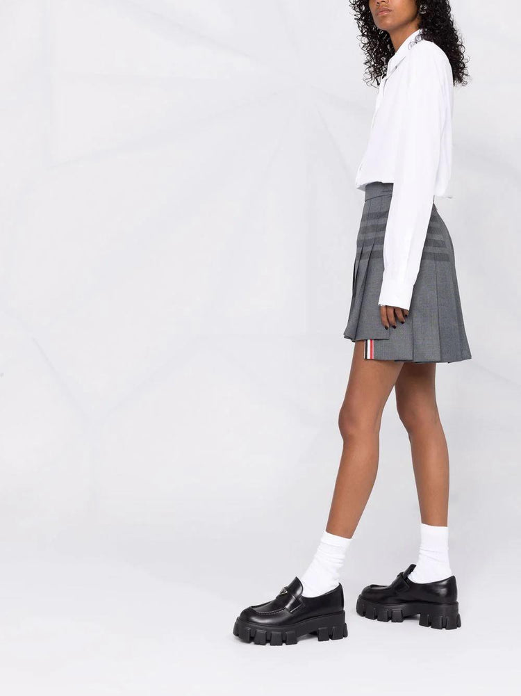 THIGH LENGTH DROPPED BACK PLEATED SKIRT W/ TONAL WOVEN 4 BAR IN STEP TWILL SCHOOL UNIFORM