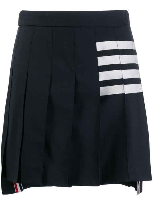 THIGH LENGTH DROPPED BACK PLEATED SKIRT IN ENGINEERED 4 BAR PLAIN WEAVE SUITING