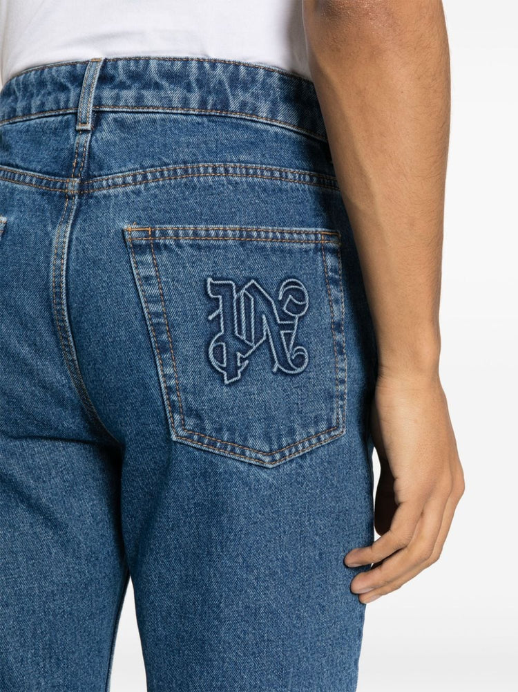 monogram-embossed straight-leg jeans