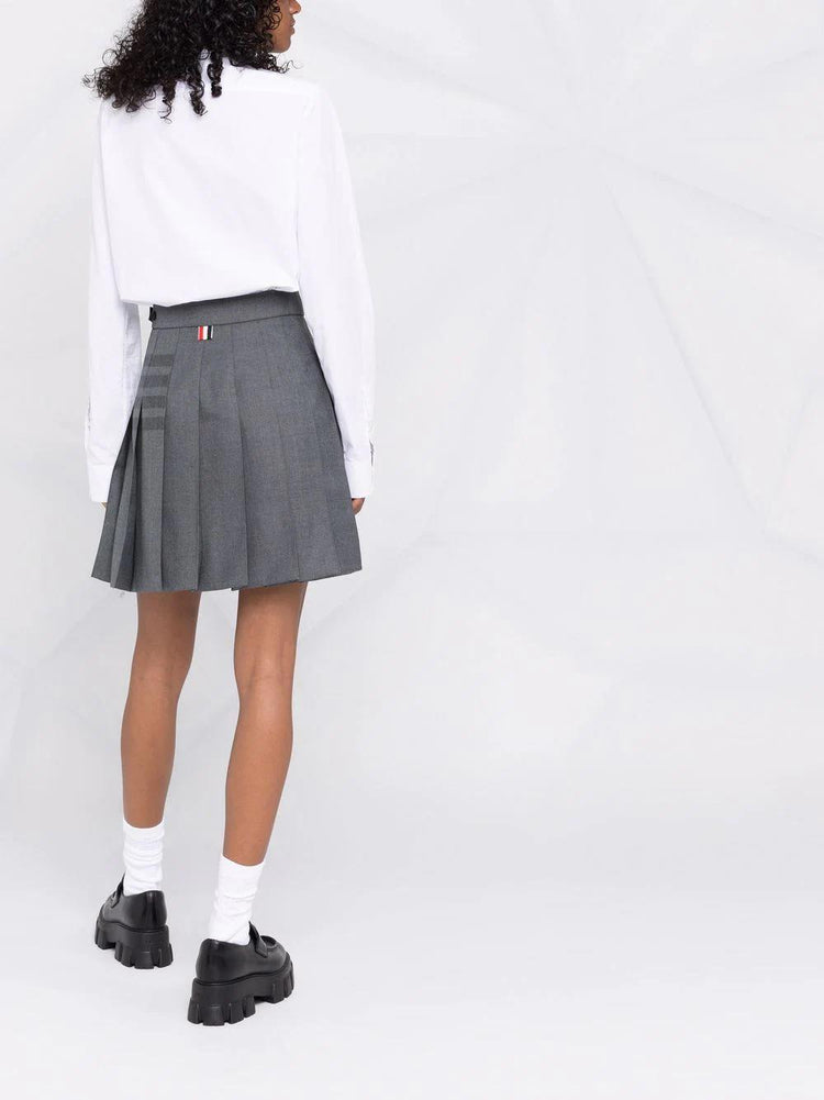 THIGH LENGTH DROPPED BACK PLEATED SKIRT W/ TONAL WOVEN 4 BAR IN STEP TWILL SCHOOL UNIFORM