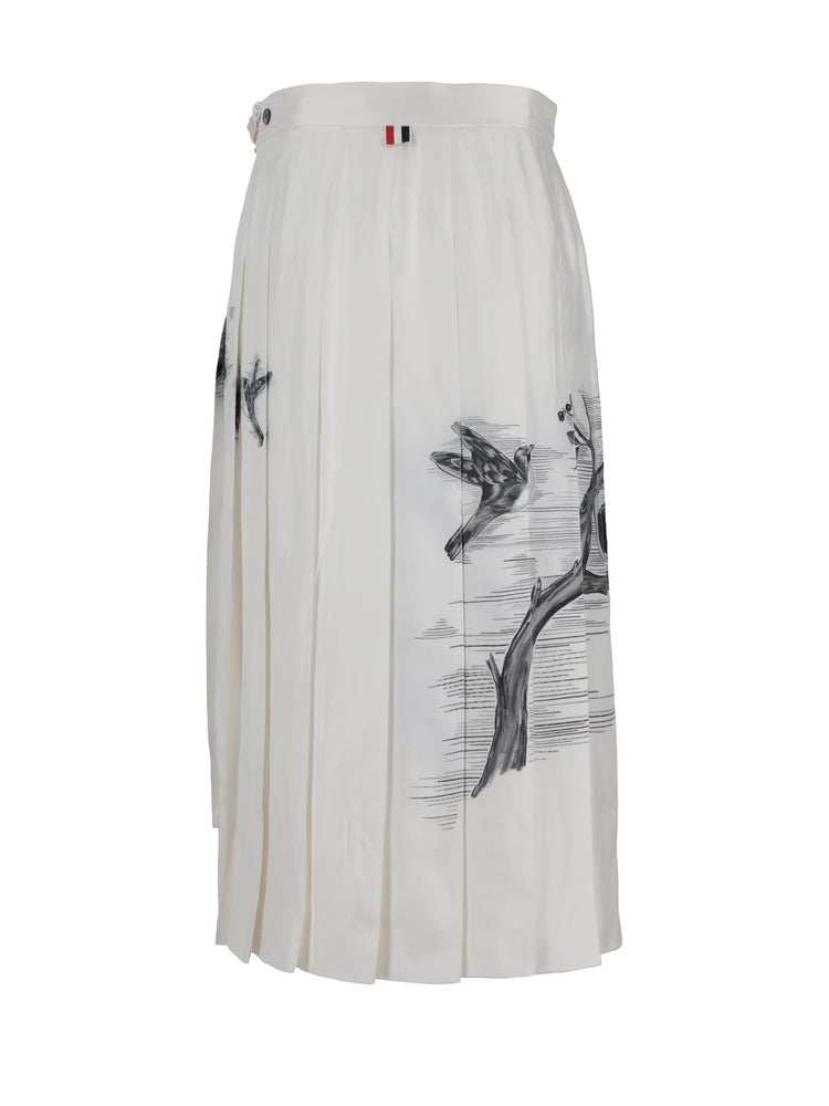 CLASSIC KNEE DROPPED BACK PLEATED SKIRT IN ENGINEERED BIRD TOILE  PRINTED SILK TWILL