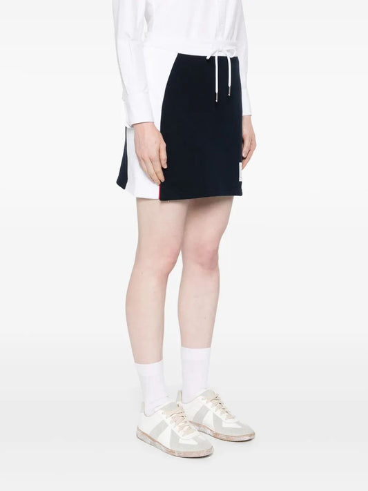 MINI SKIRT W/ ENGINEERED 4 BAR IN BLOCKED CLASSIC SOLID CLASSIC LOOPBACK JERSEY