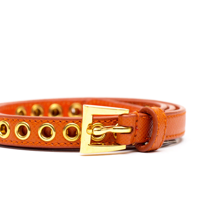 PRADA skinny eyelet belt orange