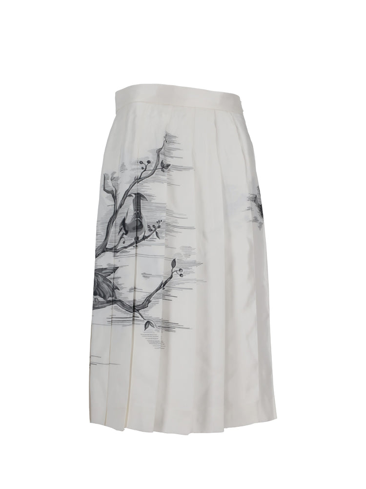 CLASSIC KNEE DROPPED BACK PLEATED SKIRT IN ENGINEERED BIRD TOILE  PRINTED SILK TWILL